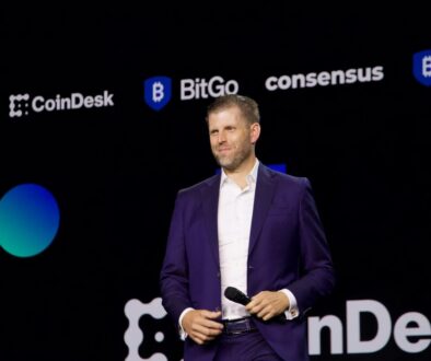 Eric Trump speaking on stage at the Consensus 2025 crypto conference