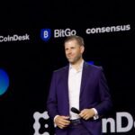 Eric Trump speaking on stage at the Consensus 2025 crypto conference